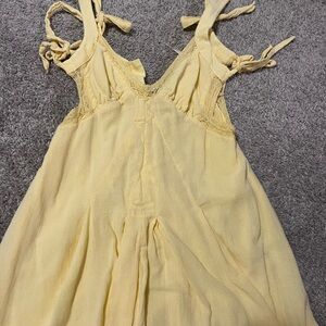 Yellow Sleeveless Dress with Lace Details